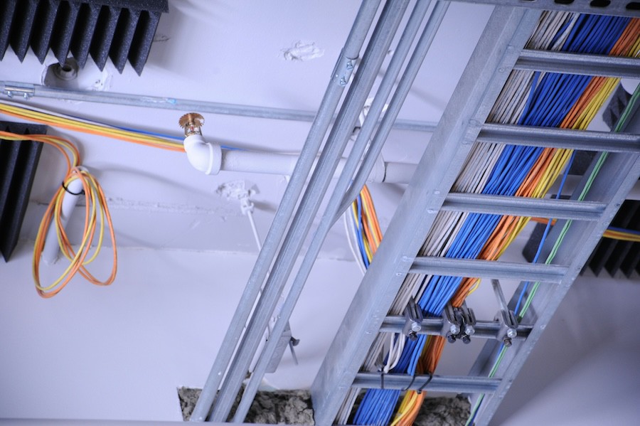 wiring and networking cable attached to the ceiling of a business space