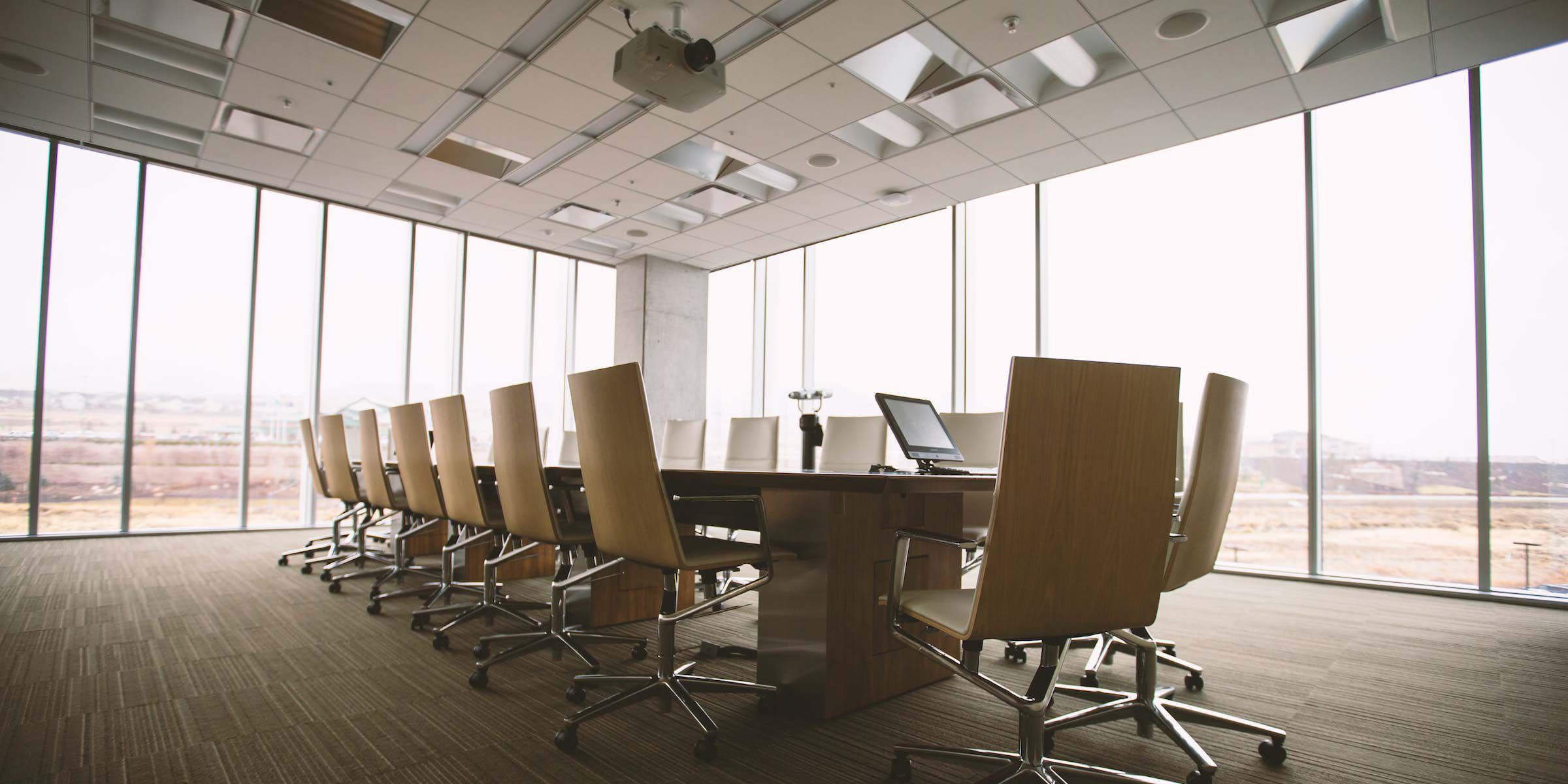 conference room with large windows and open ceiling